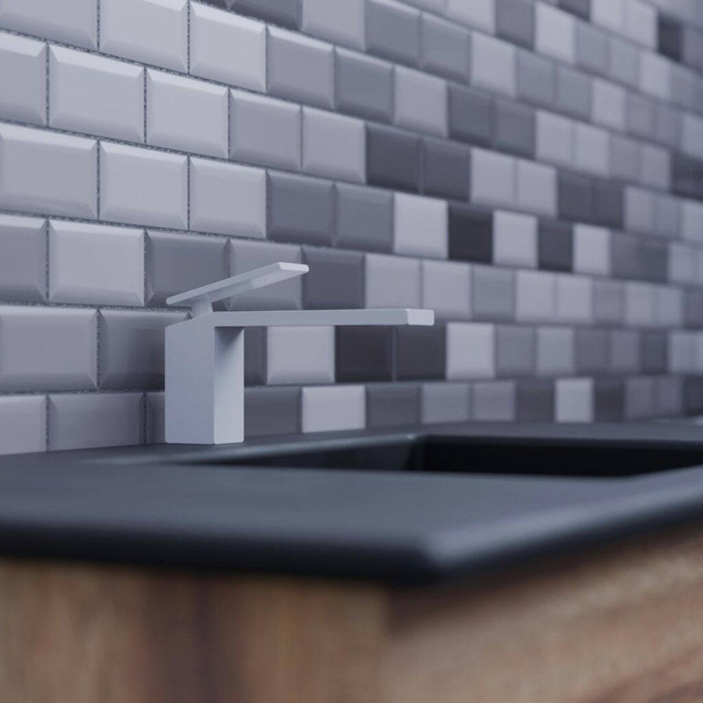 A sleek modern kitchen with a minimalist sink and stylish tiled backsplash in neutral tones.